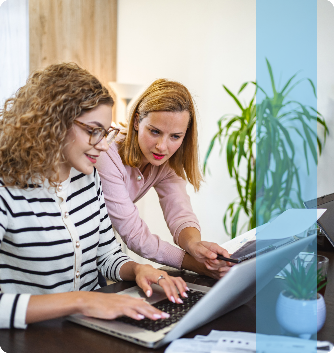 Two employees in a professional business setting representing the Konnekt Cyprus recruitment team collaborating on corporate talent acquisition.