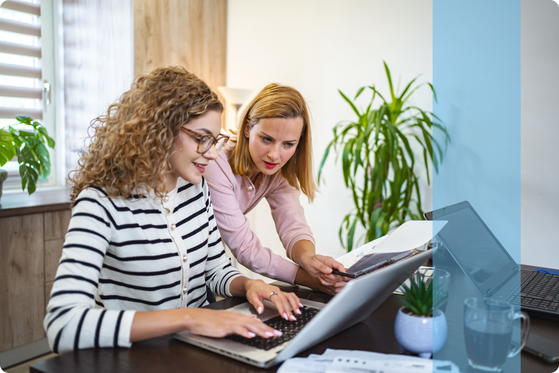 Two employees in a professional business setting representing the Konnekt Cyprus recruitment team collaborating on local corporate talent acquisition.