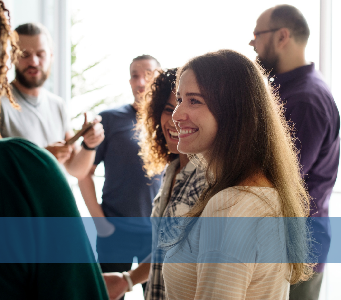 A smiling team of HR professionals collaborating, representing internal recruitment teams at Konnekt.